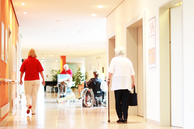 Elderly people at a hospital hall.