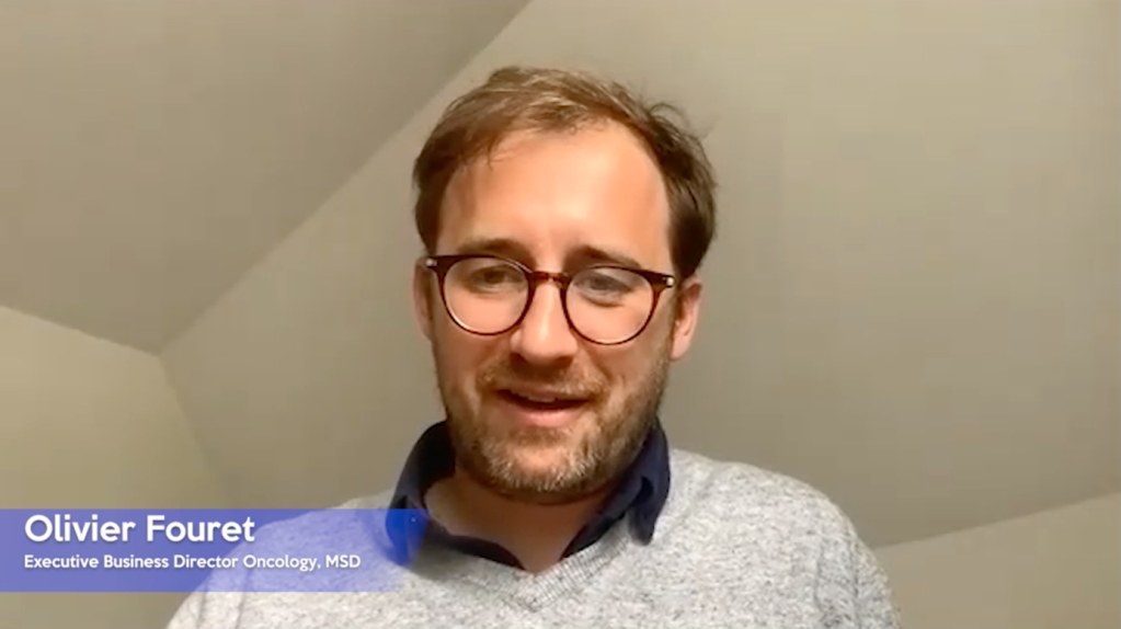 man with glasses speaking