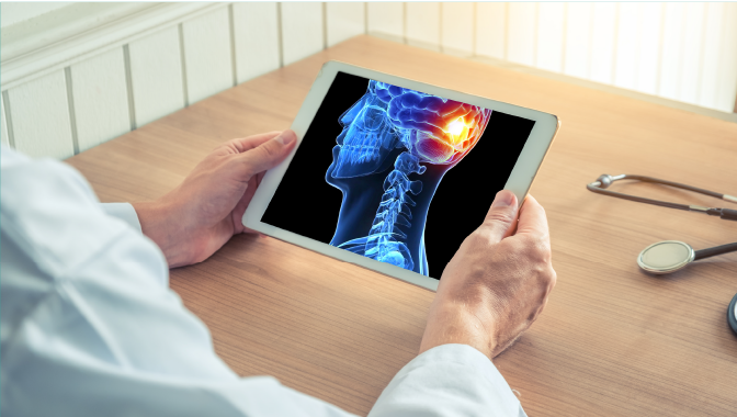 Man looking at tablet with digital illustration of a brain